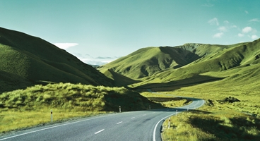 Hilly landscape with road.